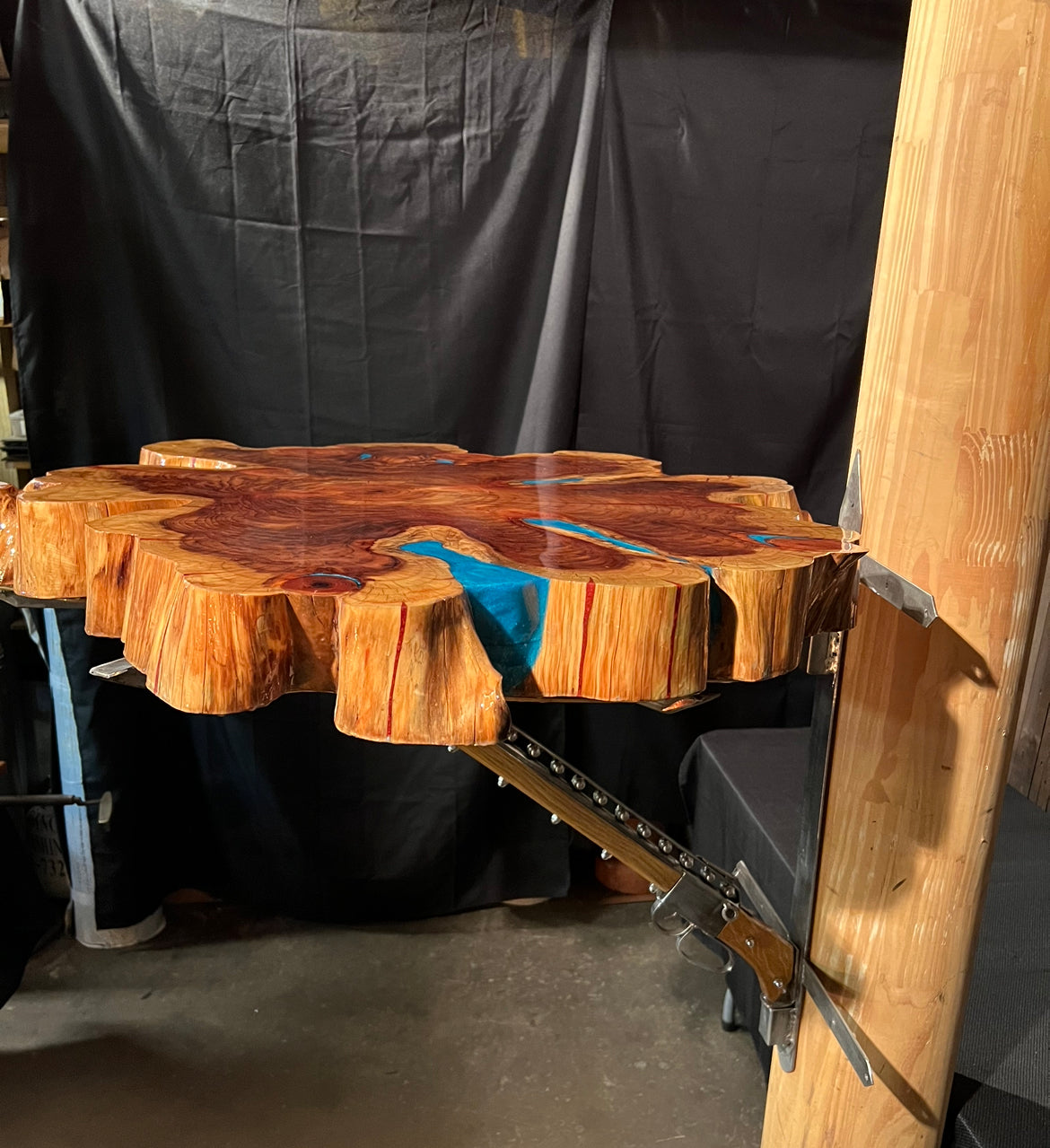 "One-of-a-kind" live edge table with a custom mount.
